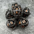 Sage's Caged Centrifuge Hollow Metal Polyhedral Dice Set image 0
