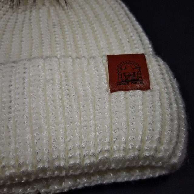 Sage’s Cap – White Knit Beanie with Raccoon Pompom image 1