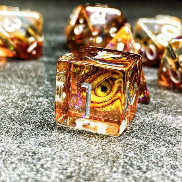 Sage's Bottled Gold Dragon Eyes Resin Polyhedral Dice Set image 9