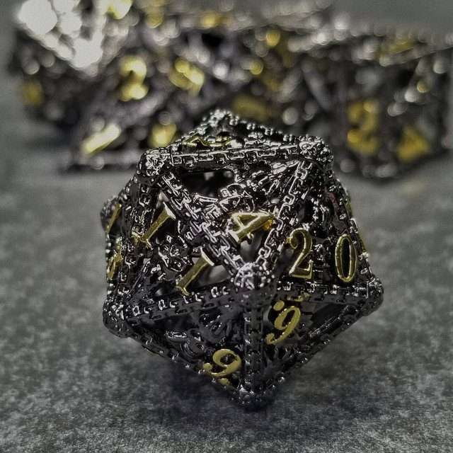 Chained Death Black/Gold Hollow Metal Polyhedral Dice Set image 1