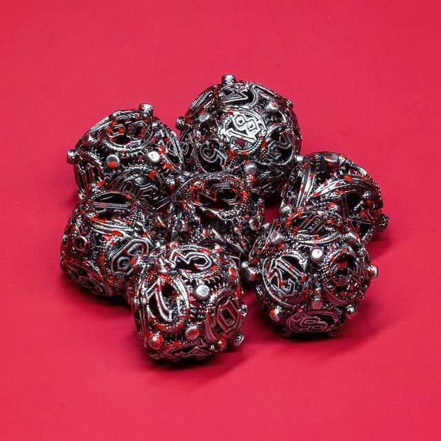 Sage’s Ouroboros Nickel Carnage Hollow Metal Polyhedral Dice Set image 0