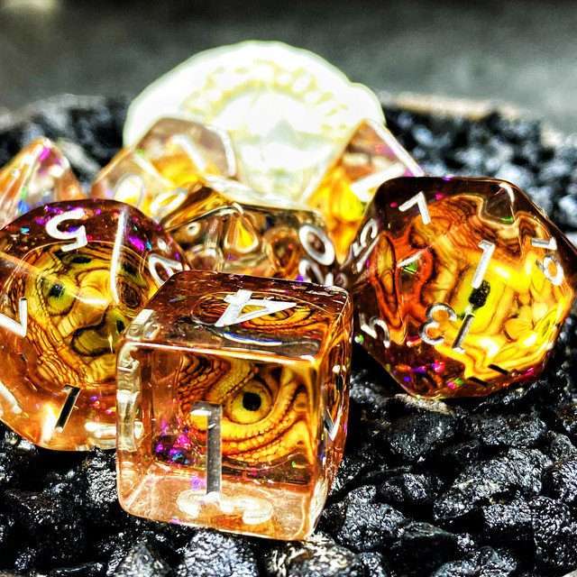 Sage's Bottled Gold Dragon Eyes Resin Polyhedral Dice Set image 0
