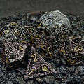 Chained Death Black/Gold Hollow Metal Polyhedral Dice Set image 0