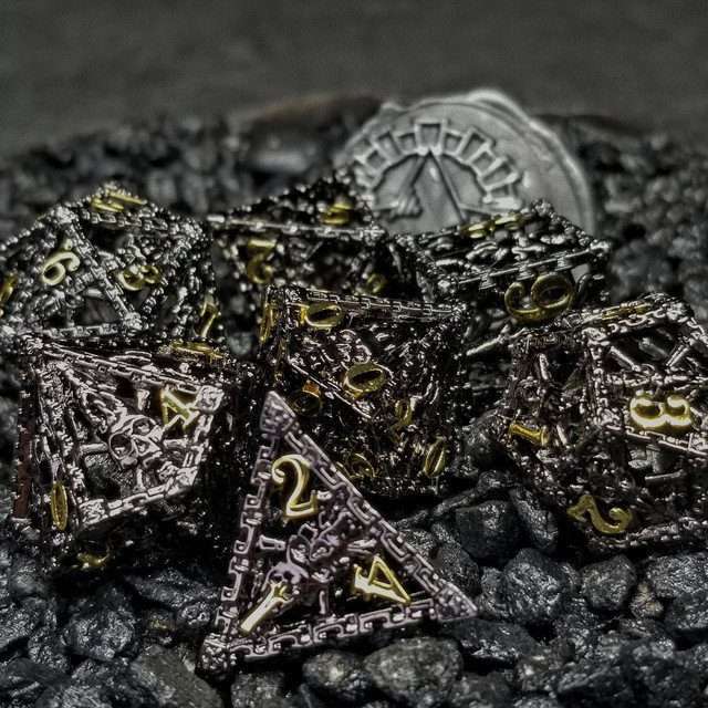 Chained Death Black/Gold Hollow Metal Polyhedral Dice Set image 0
