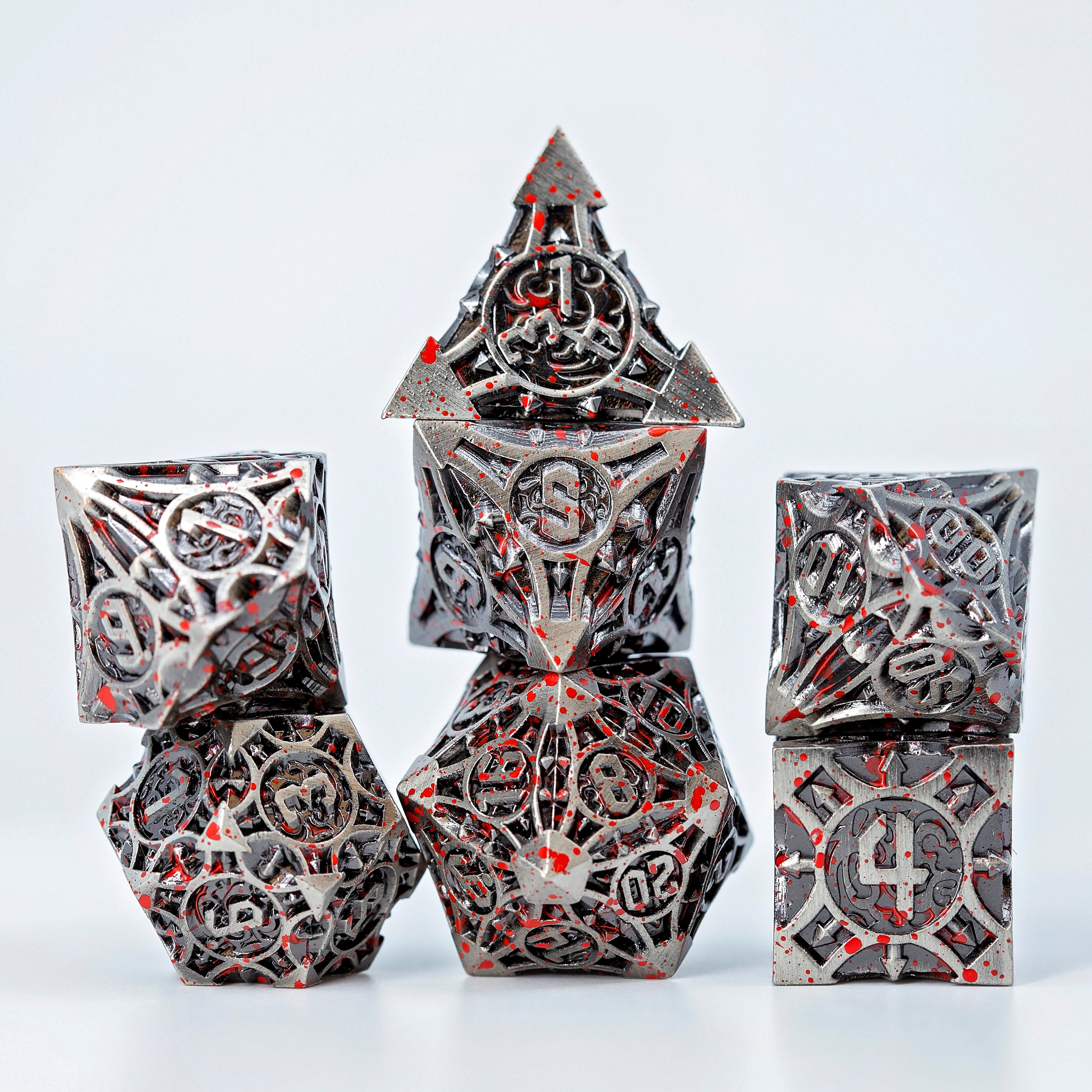Sage’s Runic Caltrops Nickel Blood Splatter Solid Metal Polyhedral Dice Set