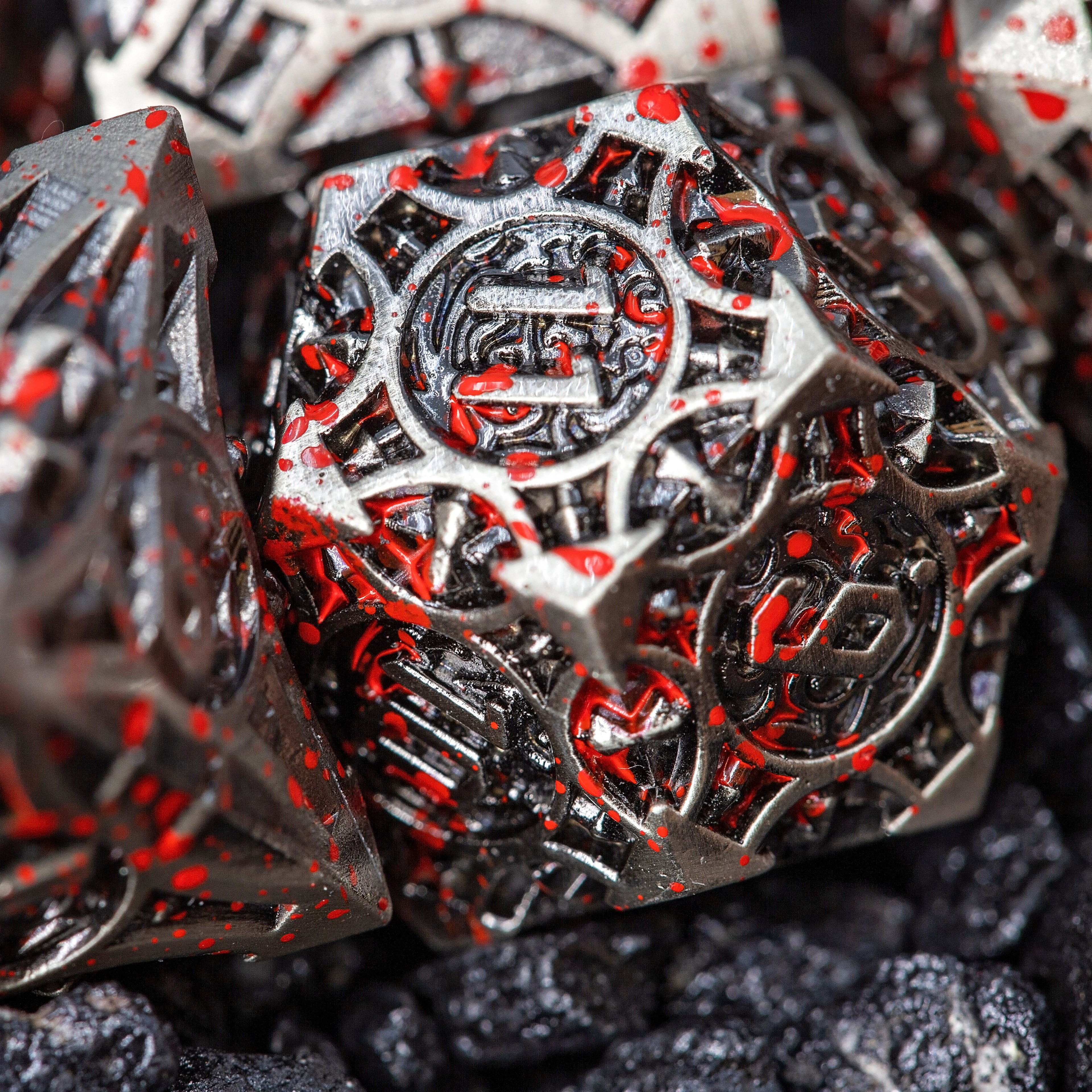 Sage’s Runic Caltrops Nickel Blood Splatter Solid Metal Polyhedral Dice Set