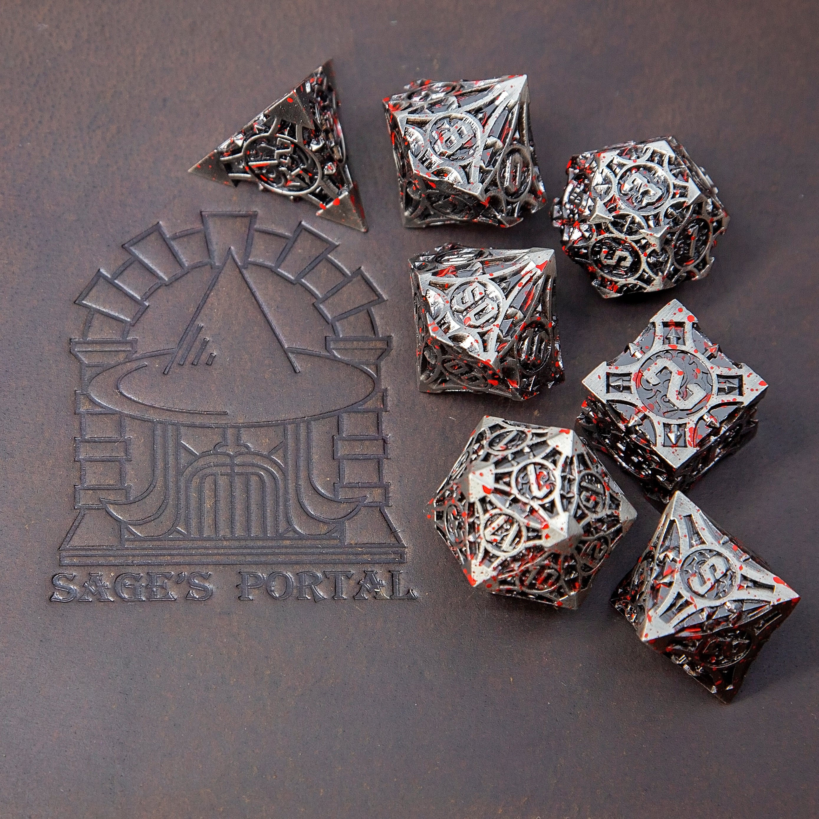 Sage’s Runic Caltrops Nickel Blood Splatter Solid Metal Polyhedral Dice Set