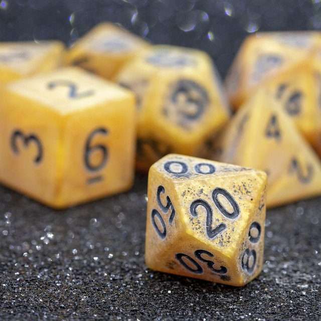 Sage's Ancient Golden Stone Black Ink Acrylic Polyhedral Dice Set - Sage's PortalAcrylic Dice Set