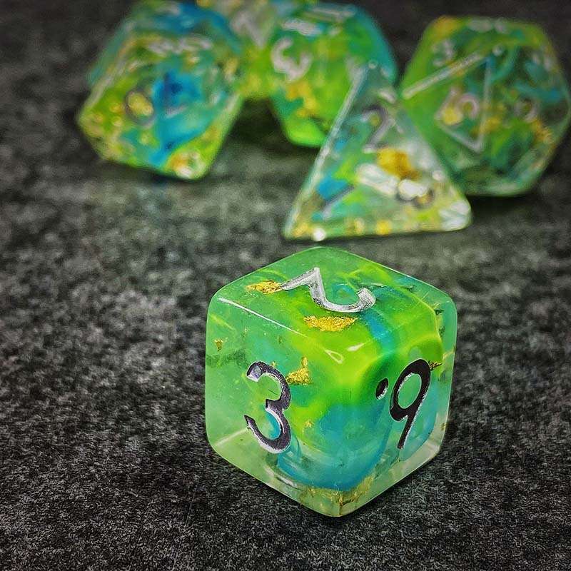 Sage's Cantrips - Green/Blue Swirl Gold Flakes Silver Ink Resin Polyhedral Dice Set - Sage's PortalResin Dice Set