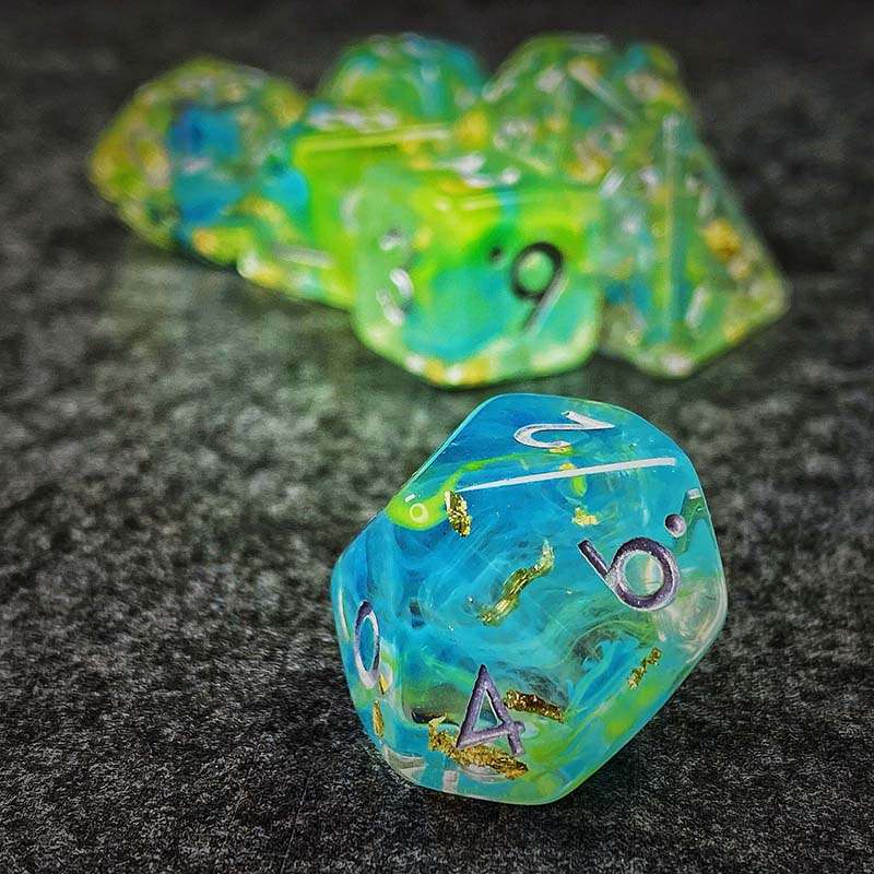 Sage's Cantrips - Green/Blue Swirl Gold Flakes Silver Ink Resin Polyhedral Dice Set - Sage's PortalResin Dice Set