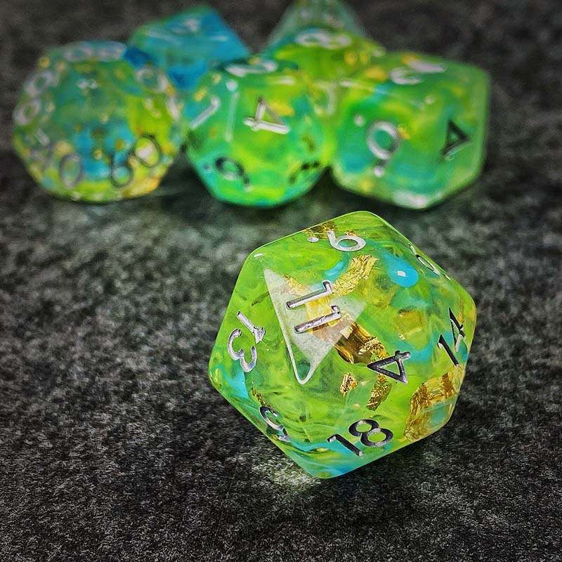 Sage's Cantrips - Green/Blue Swirl Gold Flakes Silver Ink Resin Polyhedral Dice Set - Sage's PortalResin Dice Set