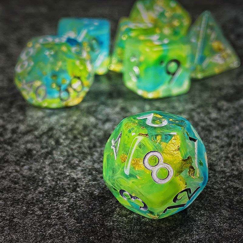 Sage's Cantrips - Green/Blue Swirl Gold Flakes Silver Ink Resin Polyhedral Dice Set - Sage's PortalResin Dice Set