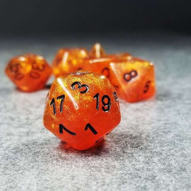 Sage’s Cantrips - Orange Glitter Gold Foil Black Ink Resin Polyhedral Dice Set - Sage's PortalResin Dice Set