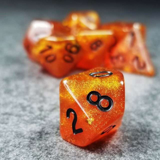 Sage’s Cantrips - Orange Glitter Gold Foil Black Ink Resin Polyhedral Dice Set - Sage's PortalResin Dice Set