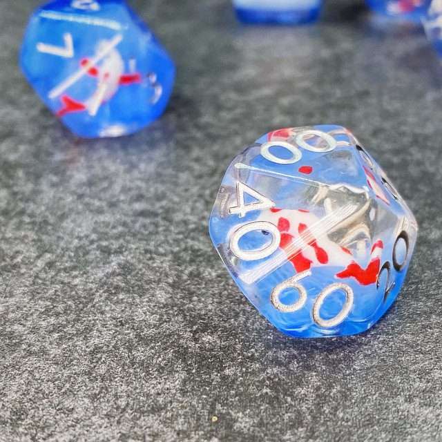 Sage's Familiars- Red Fish in Ocean Familiar Resin Polyhedral Dice Set - Sage's PortalResin Dice Set
