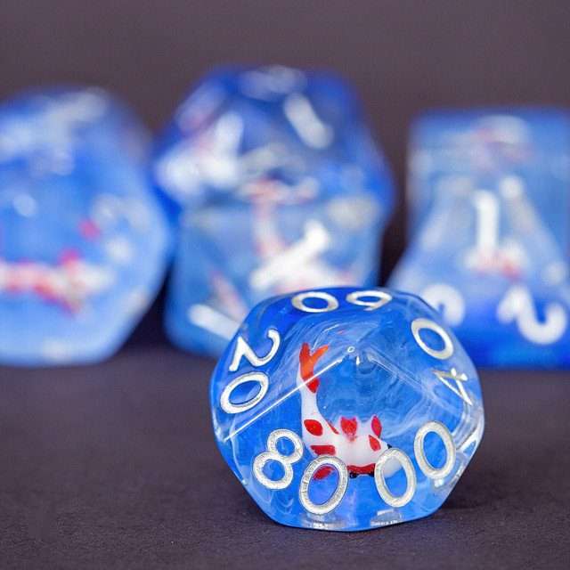 Sage's Familiars- Red Fish in Ocean Familiar Resin Polyhedral Dice Set - Sage's PortalResin Dice Set