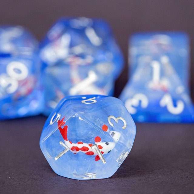 Sage's Familiars- Red Fish in Ocean Familiar Resin Polyhedral Dice Set - Sage's PortalResin Dice Set