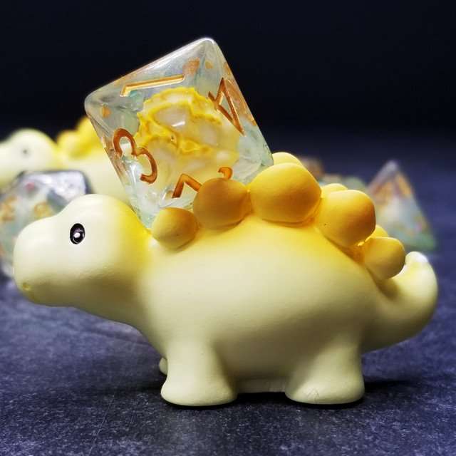 Sage's Familiars - Yellow Baby Stegosaurus Resin Polyhedral Dice Set - Sage's PortalResin Dice + Figurine Set