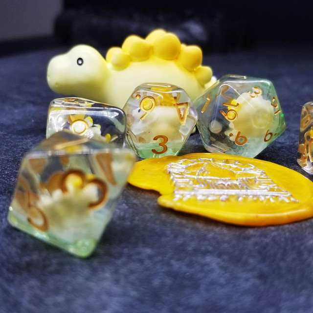 Sage's Familiars - Yellow Baby Stegosaurus Resin Polyhedral Dice Set - Sage's PortalResin Dice + Figurine Set