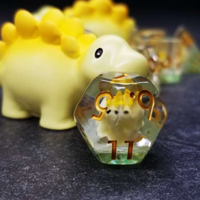 Sage's Familiars - Yellow Baby Stegosaurus Resin Polyhedral Dice Set - Sage's PortalResin Dice + Figurine Set