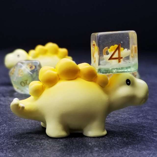 Sage's Familiars - Yellow Baby Stegosaurus Resin Polyhedral Dice Set - Sage's PortalResin Dice + Figurine Set